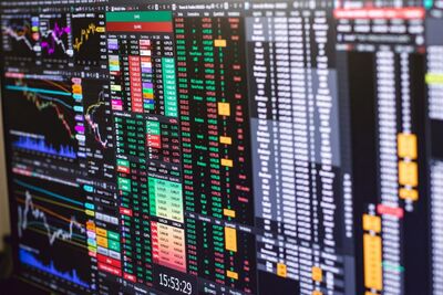 Financial trading screen with colorful charts representing stock market fluctuations