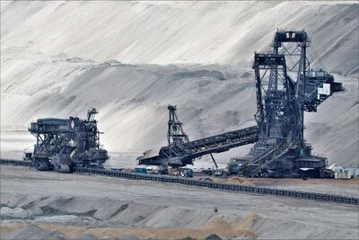 Large bucket wheel excavator operating in industrial nickel mining area