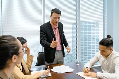 Business professionals discussing strategy during corporate meeting