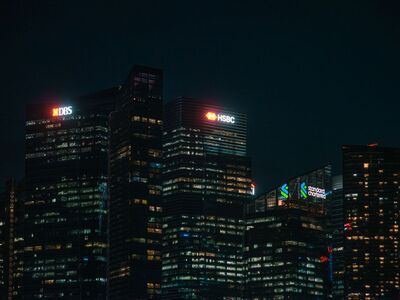 Illuminated city skyscrapers of banks in Singapore financial district