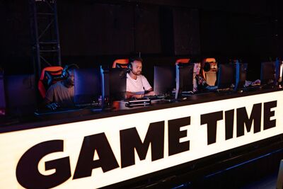 Professional esports tournament arena with competing teams